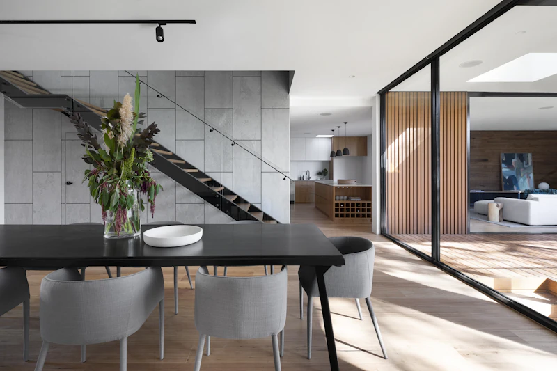 A modern kitchen with a dark island. Illustrative photography.